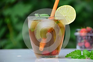 summer drink, tea with wild berries, lime, raspberries and blueberries, summer vacation, vacations. Raspberry mojito
