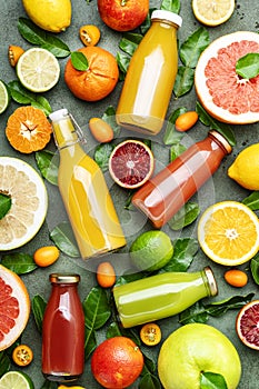 Summer drinks. Citrus fruit juices, fresh and smoothies, food background, top view. Mix of different whole and cut fruits: orange