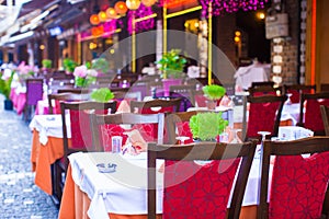 Summer empty open air restaraunt at tourist city