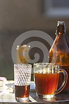 Summer evening. Colored drinks in various glassware on the outdoor table, a party in the backyard house with cold drinks, A set