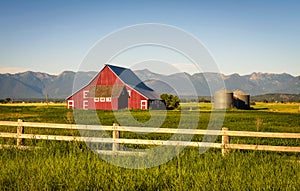 Summer evening with a red barn in rural Montana