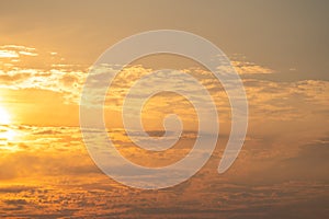 summer evening, sunset in yellow, orange and pink with clouds