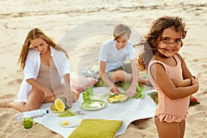 Summer. Family Picnic On Beach. Portrait Of Young Woman With Kids Enjoying Lunch At Tropical Ocean.