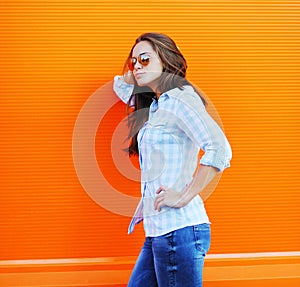 Summer, fashion and people concept - pretty woman in sunglasses