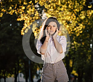 Summer fashion portrait beautiful stylish girl posing outdoor