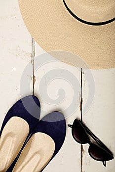 Summer fashion set. Women`s hat, ballet flats and sunglasses.