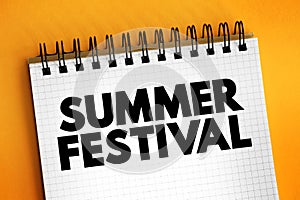 Summer Festival is a festival held during the summer, text concept on notepad
