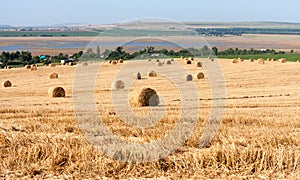 Summer Field with Hay Bales as background