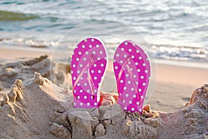pink polka dot flip-flops