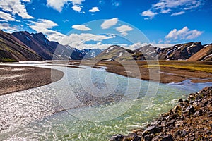 Summer flood of meltwater flooded the road to tourist camping