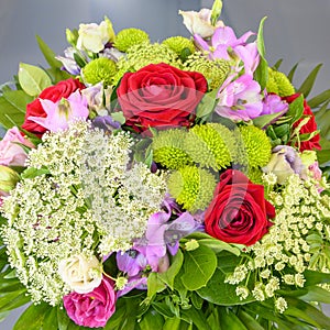 Summer flowers in arrangement, luxury bouquet with beautiful red roses, carrot umbel and sweetwilliams photo