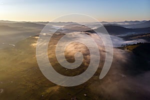 Summer foggy sunrise in Bucovina