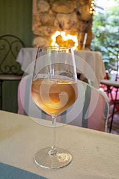 Summer on French Riviera Cote d`Azur, drinking cold rose from Cotes de Provence on outdoor terrase in old cafe, Var, France