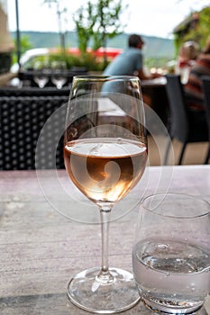 Summer on French Riviera Cote d`Azur, drinking cold rose  wine from Cotes de Provence on outdoor terrase in cafe