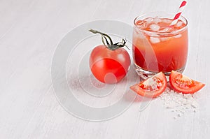 Summer fresh drink - cold alcoholic cocktail bloody Mary - pulpy red tomato juice on light white wooden board, copy space.