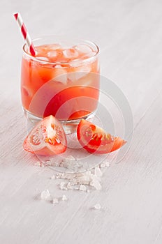 Summer fresh drink - cold alcoholic cocktail bloody Mary - pulpy red tomato juice on light white wooden board, copy space.
