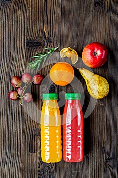 Summer fresh drink in plastic bottle on wooden background top view mock-up