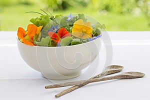 Summer fresh flowers salad in bowl