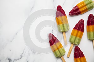 Summer fruit ice lolly popsicle on a marble background