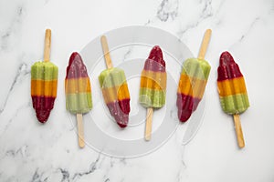 Summer fruit ice lolly popsicle on a marble background