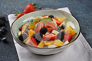 Summer Fruit salad with oranges, strawberries, blueberries, blackberries and fresh mint. Healthy food