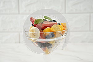 Summer Fruit salad with oranges, strawberries, blueberries, blackberries and fresh mint. Healthy food