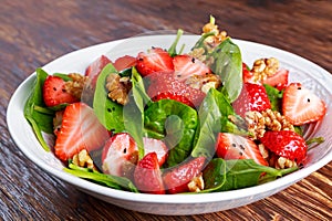 Summer Fruit Vegan Spinach Strawberry nuts Salad. concepts health food