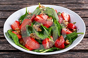 Summer Fruit Vegan Spinach Strawberry nuts Salad. concepts health food