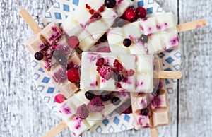 Summer fruits and berry homemade lolly pops ice cream. Group of