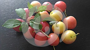 Summer fruits. Organic fresh fruits on a black wooden table.