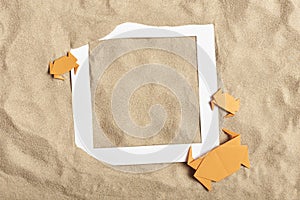 Summer fun design, sand background, paper crabs, empty frame. Beach, vacations