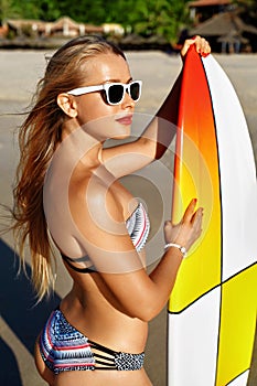 Summer Fun. Leisure Sporting Activity. Surfing. Woman With Surfboard