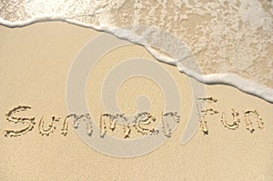 Summer Fun Written in Sand on Beach