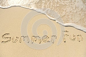 Summer Fun Written in Sand on Beach photo