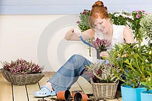 Summer garden terrace redhead woman potted flower