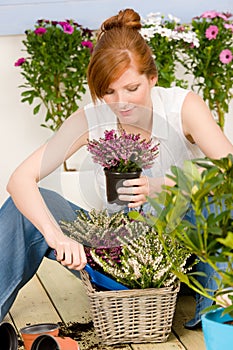 Summer garden terrace redhead woman potted flower