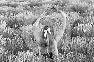 summer girl in lavender sunset field enjoying freedom and nature on summer day