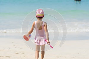 Summer girl play travel in holiday on tropical summer beach. Cheerful Joyful seaside with cute kid vacation on sunny day