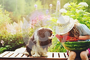 Summer happy child girl eating watermelon outdoor on vacation