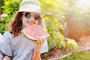summer happy child girl eating watermelon outdoor on vacation