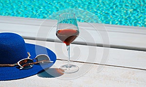 Summer hat and glass of wine