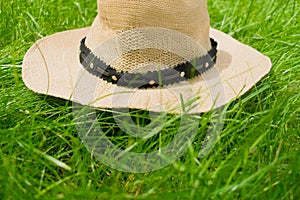 Summer hat from the sun lying on the  grass. photo