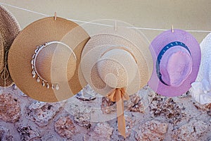 Summer hats hanging from a rope in a street market, Brihuega, Guadalajara, Castilla La Mancha, Spain