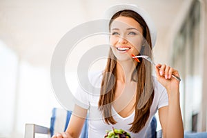 Summer, health and food concept. Young attractive lady is having