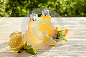 Summer healthy non alcoholic cocktails, citrus infused water drinks, lemonades with lime lemon or orange, diet detox beverages.