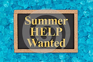 Summer Help Wanted word message on grunge chalkboard sign