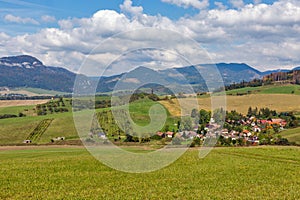 Summer hills landscape with Benusovce village in Slovakia.