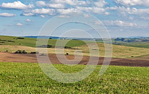 Summer hills landscape with tractor in Slovakia.