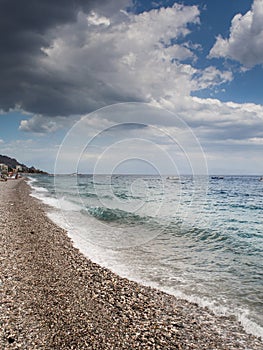 Summer holiday background, Sicily coast, Clear blue wave of the Mediterranean sea, Selective focus. Vertical image