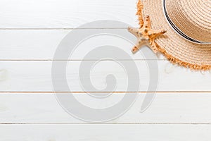 Summer holiday beach background with travel healthcare accessories top viewon white wood background, top view